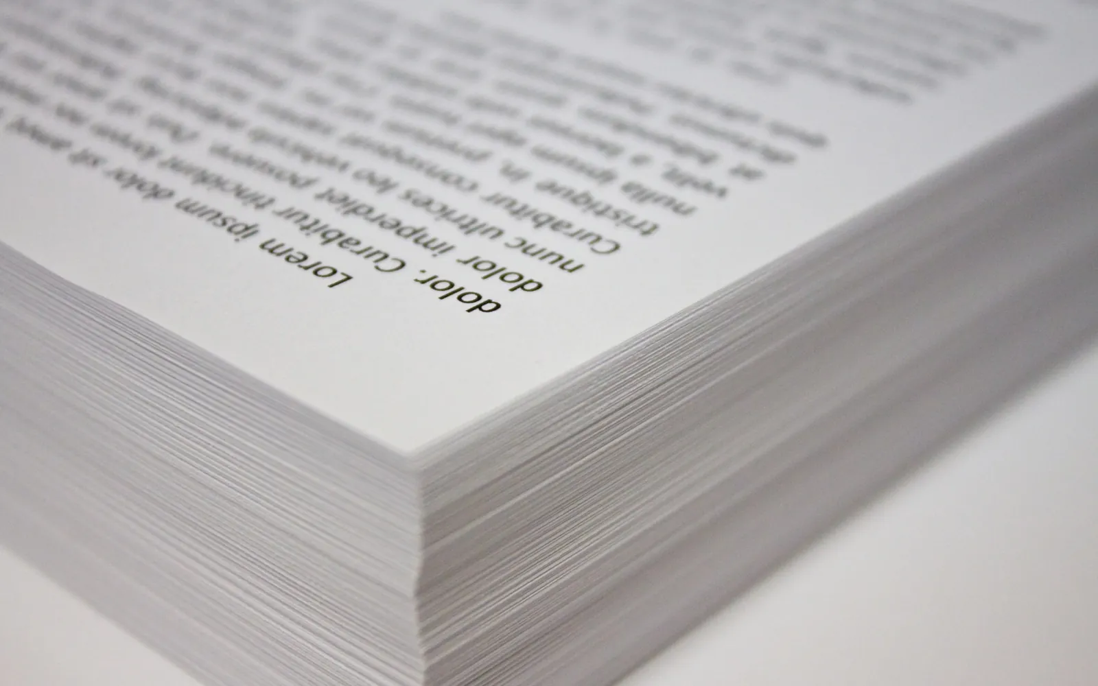 Close-up of a neat stack of printed white office copy paper